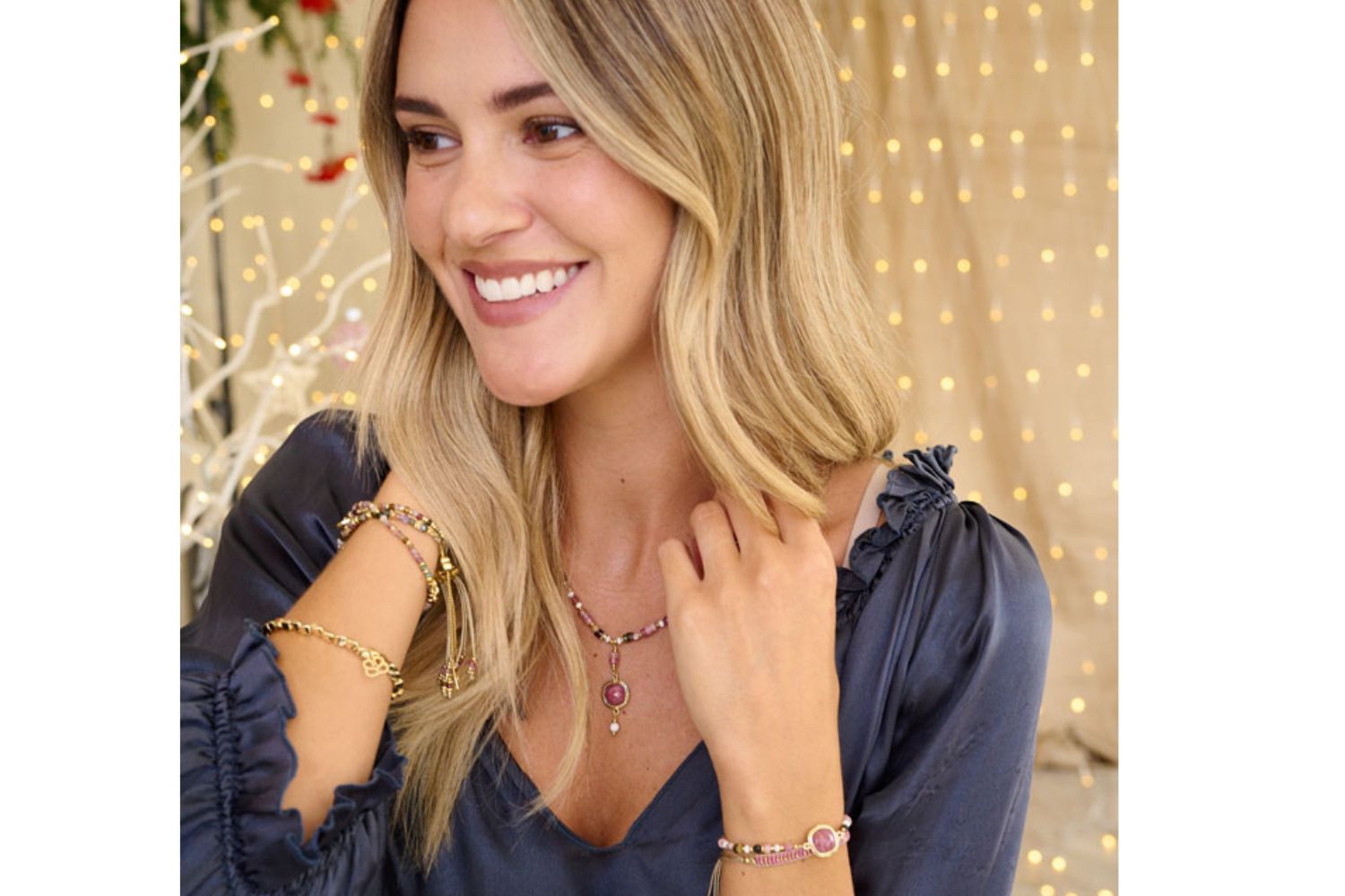 Lifestyle shot showcasing the Adria Pink Tourmaline Gemstone Bracelet and Metis Pink Tourmaline necklace, showcasing perfect bracelet stacking and layering. The perfect gift for her.