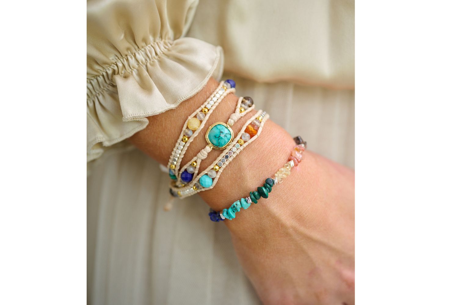 Lifestyle shot showcasing the Kenzo multi crystal friendship bracelet layered with America mixed turquoise wrap bracelet. the perfect gift with meaning 