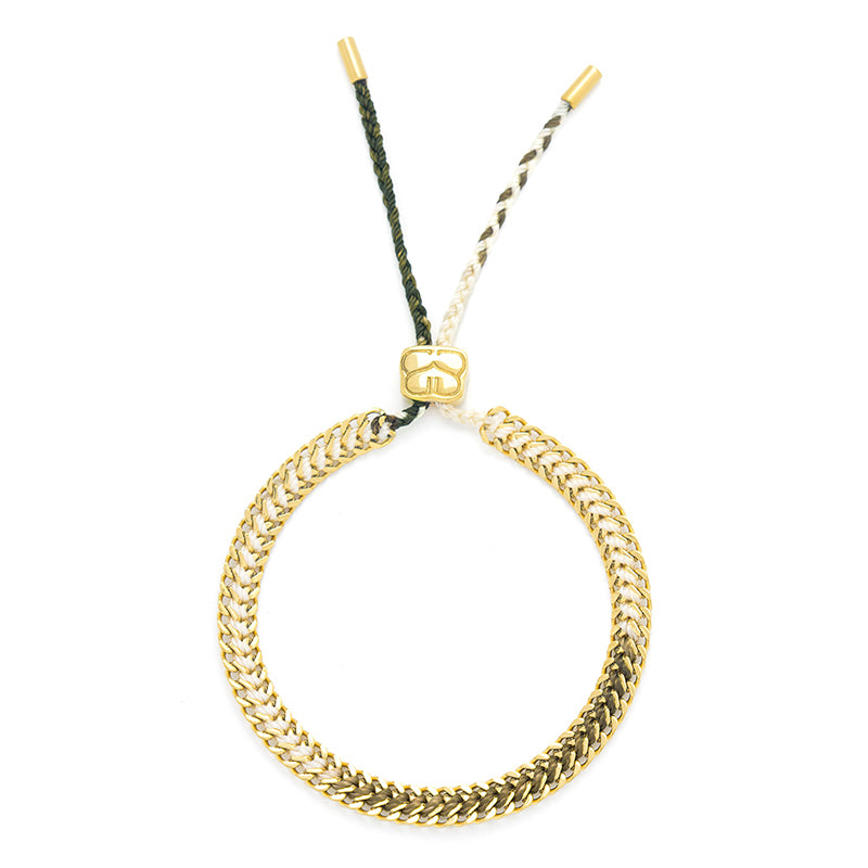 Flat Lay of the Athena White and Gold Bracelet with sparkling gold accents.