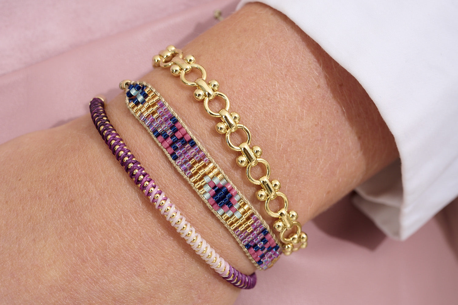 Shine bright this summer with the Infinite Gold Bracelet that sits wonderfully with purple and pink ombre tones.