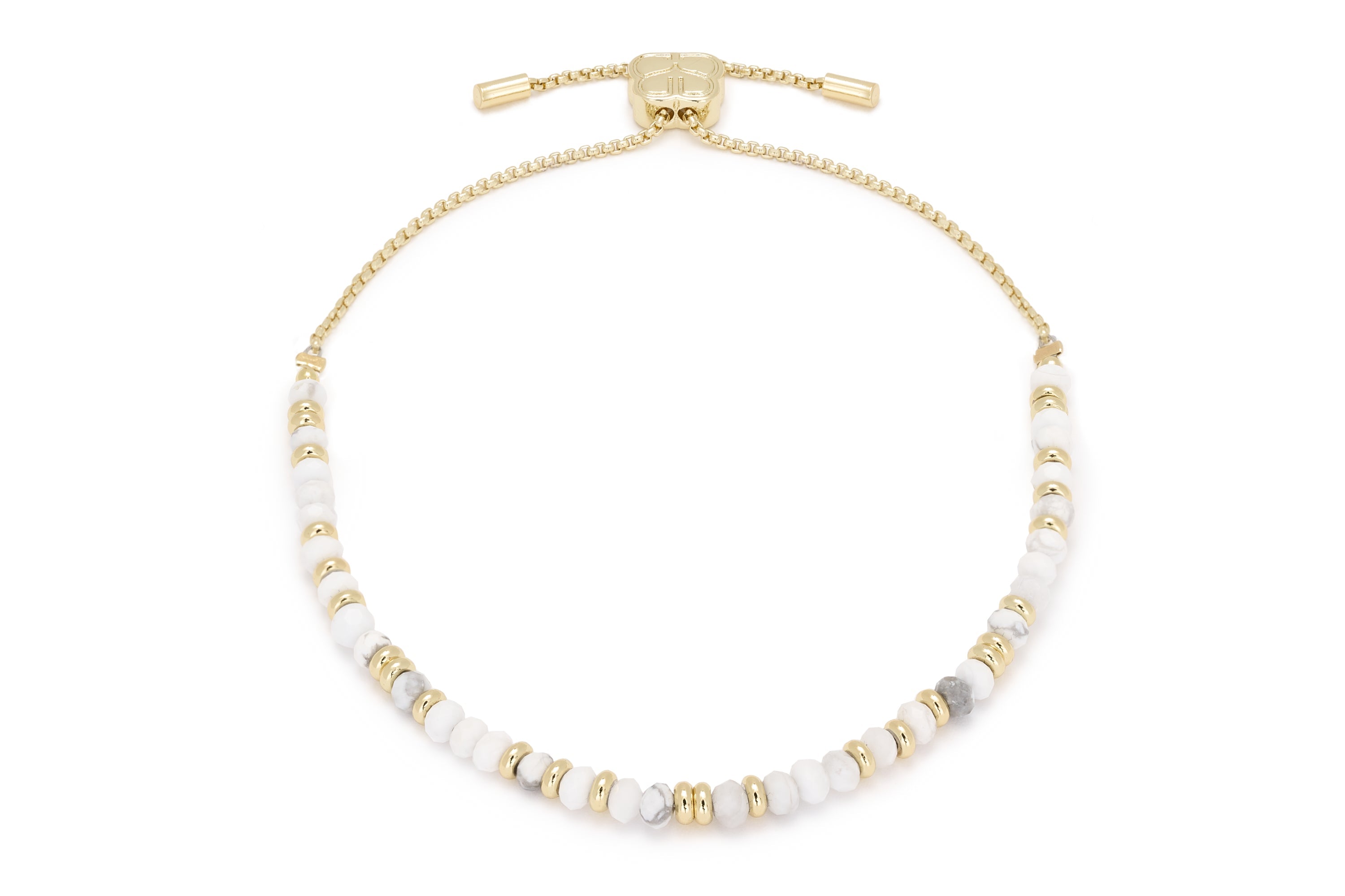 Mystical White Howlite Gold Bracelet Stack featuring smooth white howlite beads and 12k gold-plated accents, perfect for a serene, luxurious look