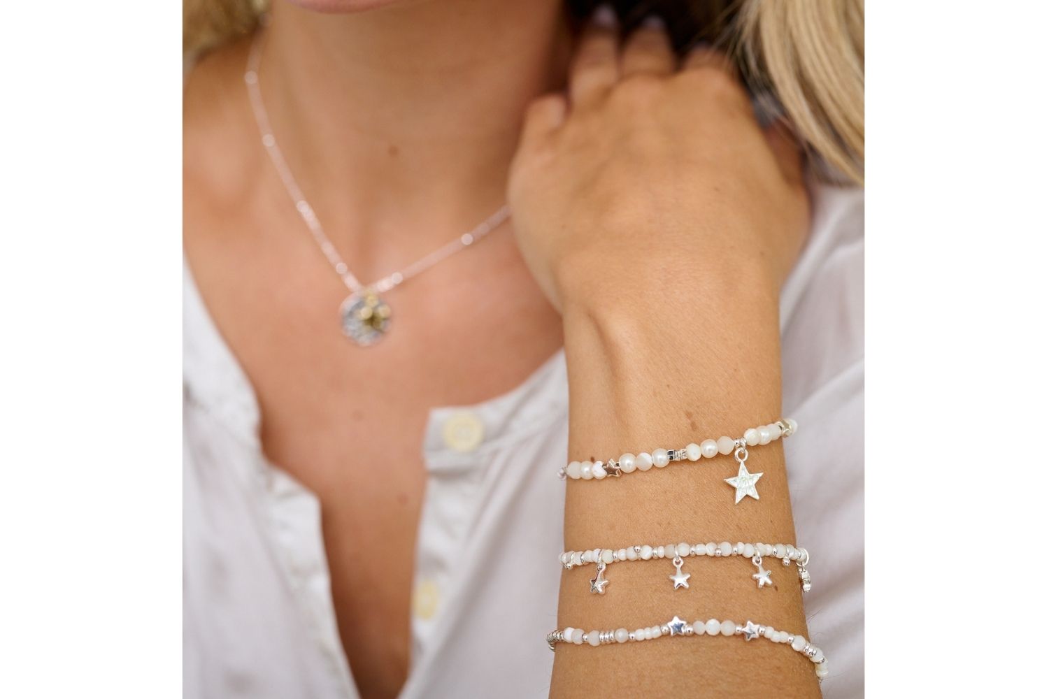 Lifestyle picture showing Orion Stack which features, Regulus, Sirius and polar moonstone bracelets 