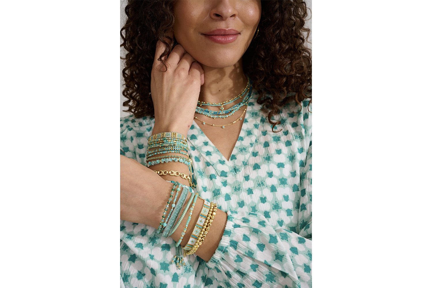 Allegra Amazonite and Apatite Gold Necklace styled for tropical and boho-chic looks, showcasing vibrant aqua beads and golden accents, perfect for sun-soaked adventures and casual elegance.