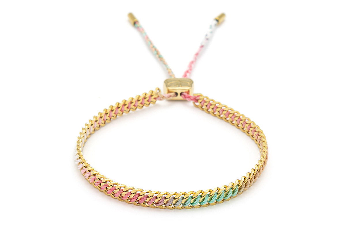 Athena Candy Gold Braided Bracelet featuring pink, clementine, and mint ombre thread woven through gold curb chain, ideal for summer adventures and adding a playful pop of colour.