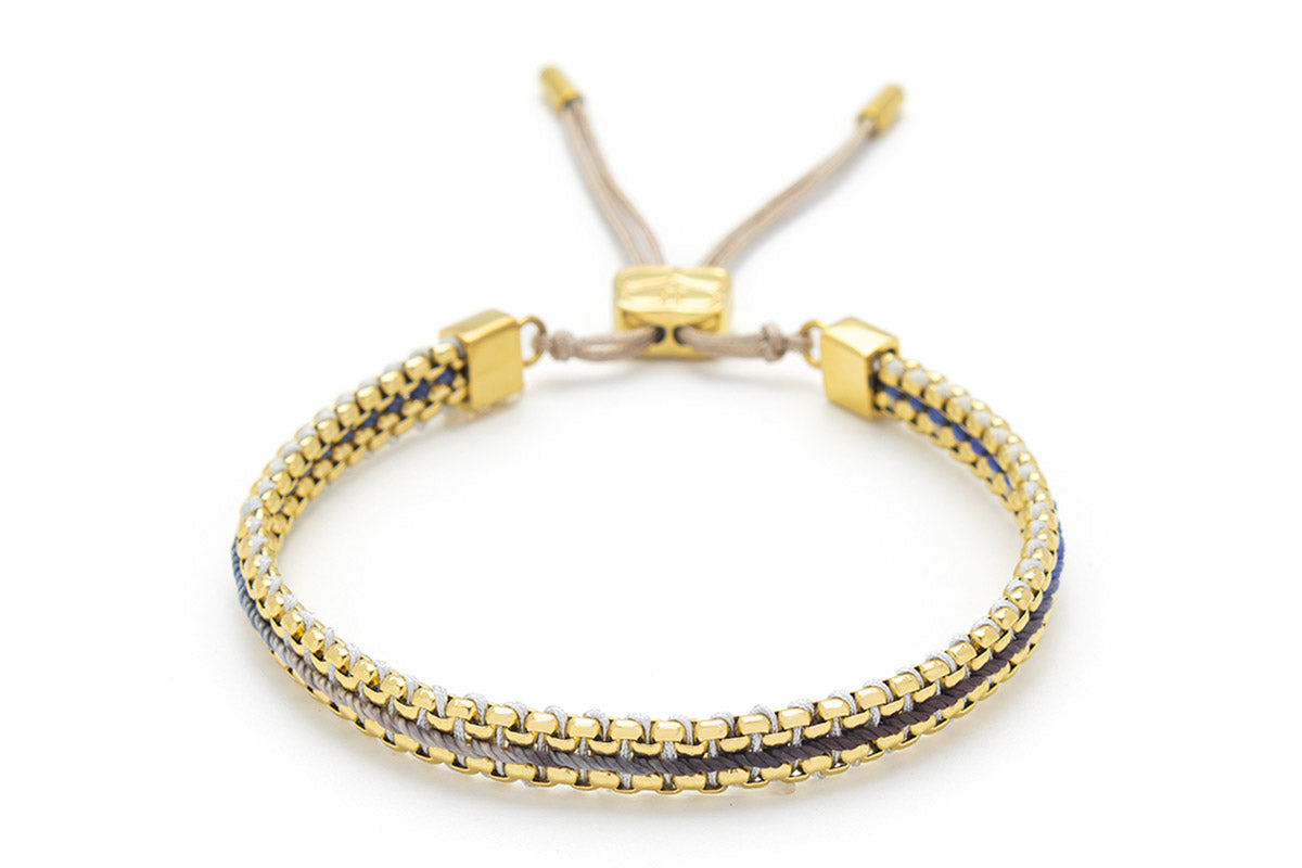 Bloom Denim Gold Braided Bracelet featuring blue ombre thread and 14k gold-plated snake chain, perfect for casual wear or gifting as summer jewellery.