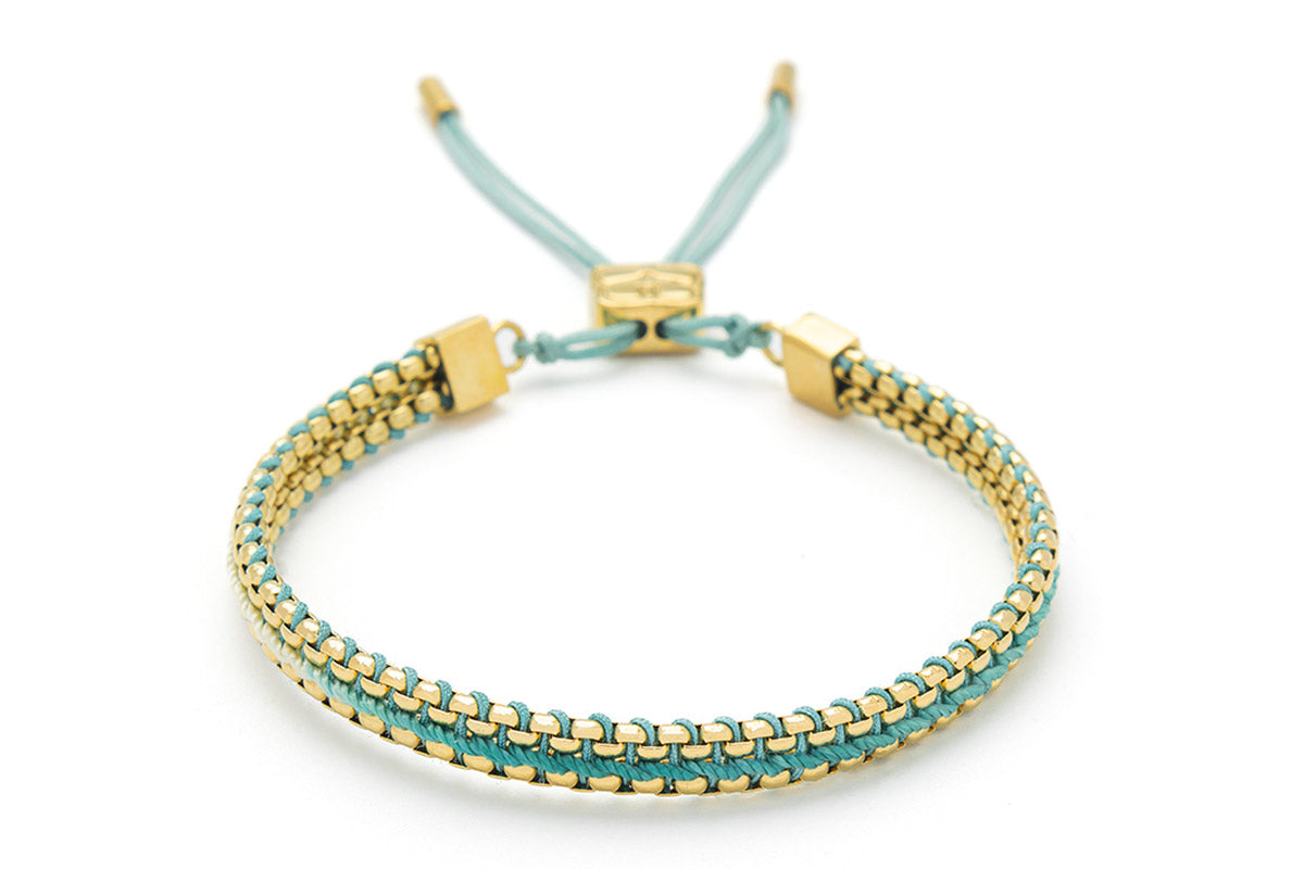 Bloom Gold & Turquoise Braided Bracelet featuring turquoise ombre thread and 14k gold-plated snake chain, perfect for beachwear or gifting as holiday jewellery.