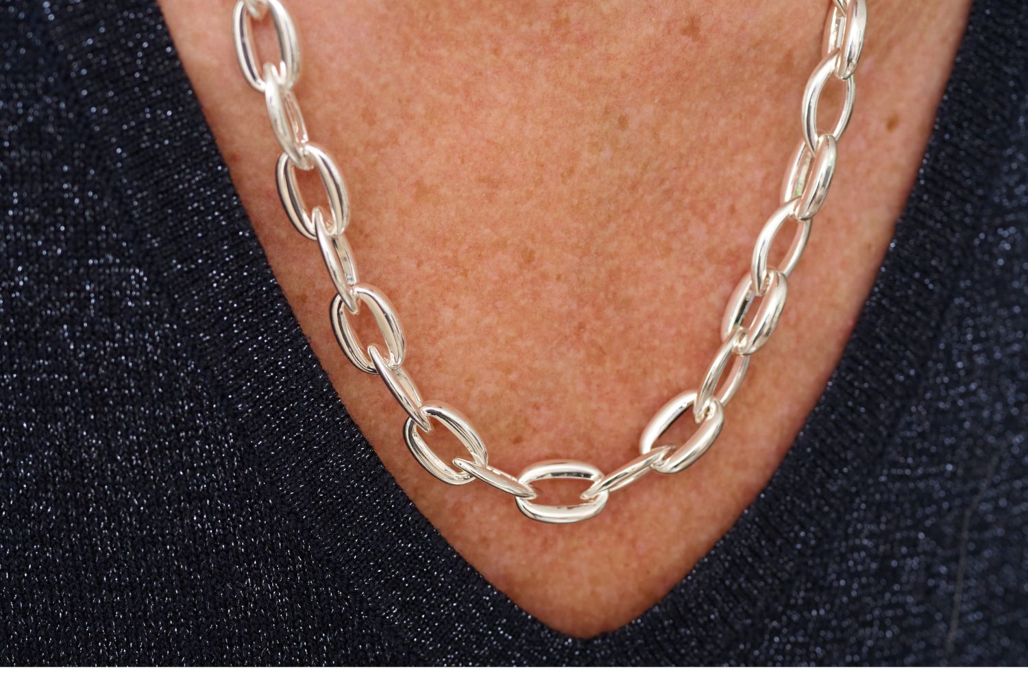 Errai Silver Chunky Chain Necklace styled with an elegant outfit, showcasing its chunky silver links and polished finish for a bold, modern statement.