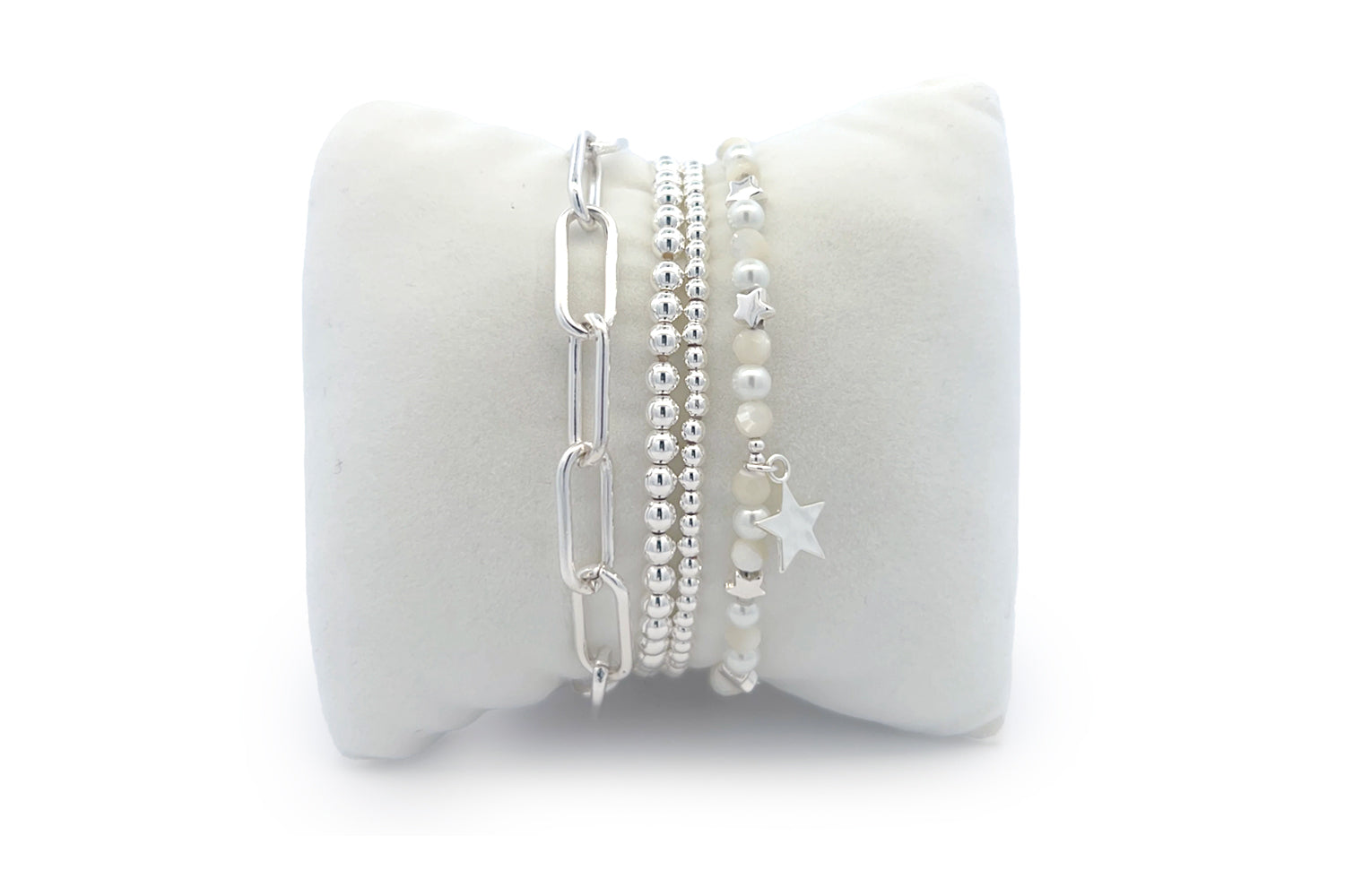 Gabriel Silver Star Stacking Bracelet featuring layered silver chain links, shimmering beads, and mother of pearl accents for a celestial-inspired, elegant look.