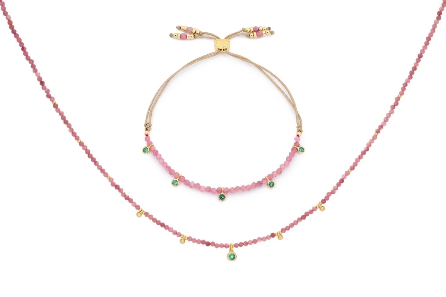 Holly Pink Tourmaline Necklace and Bracelet Set featuring pink tourmaline gemstone beads, emerald-green CZ charms, and 12k gold-plated accents, designed for elegant and joyful styling.