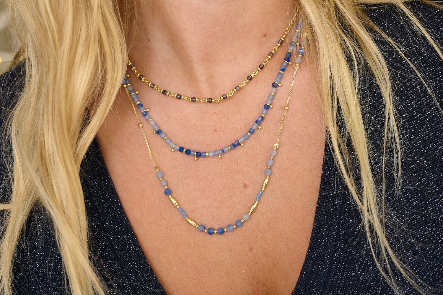 Horus Gold & Blue Aventurine Gemstone Necklace styled on the neckline, showcasing shimmering blue gemstones and gold accents, perfect for layering or wearing solo for a serene, bohemian look.