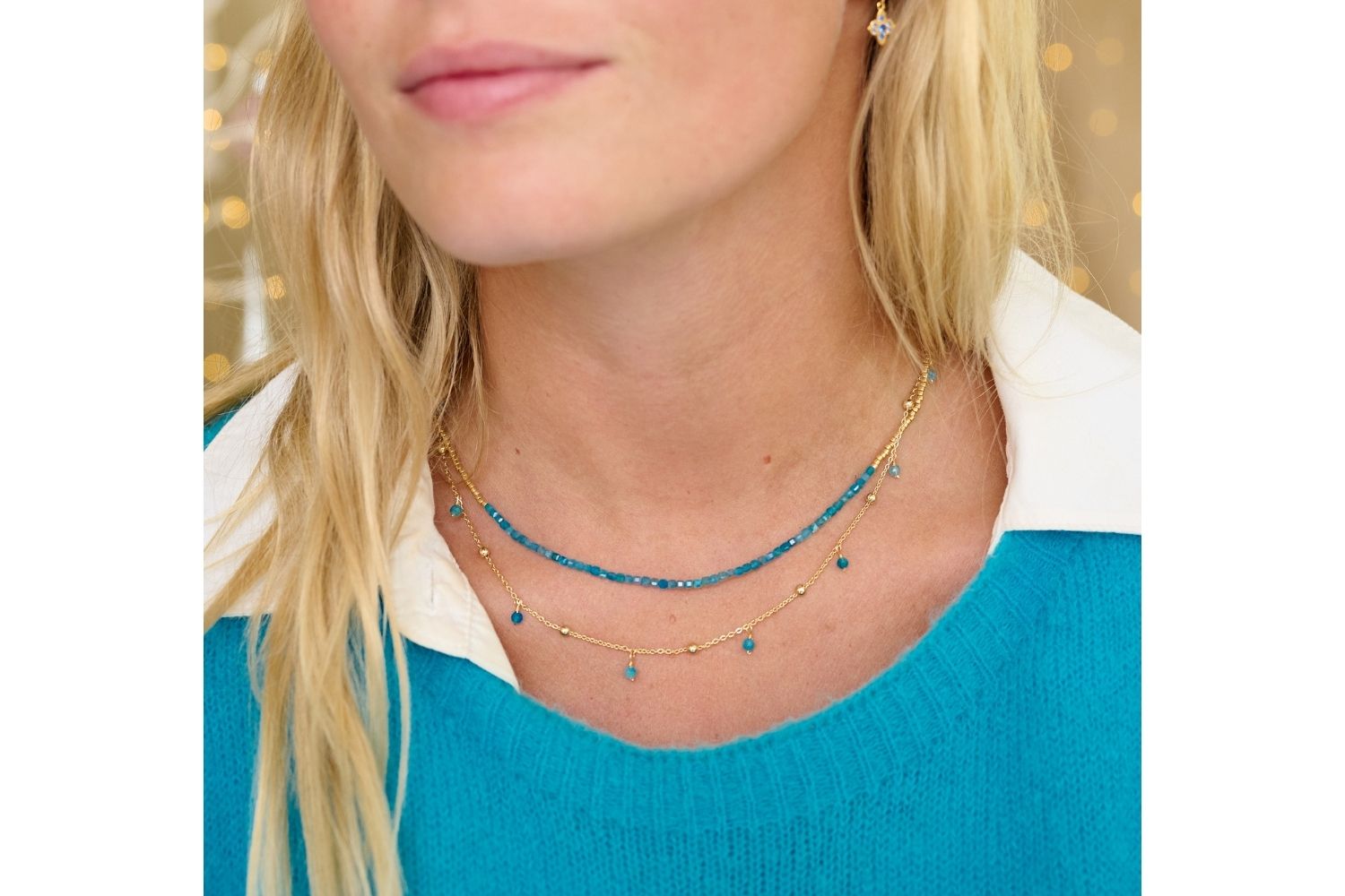 Lily Gold & Apatite Gemstone Beaded Necklace styled on the neck, showcasing sparkling turquoise apatite beads and delicate gold chains, ideal for carefree summer looks.