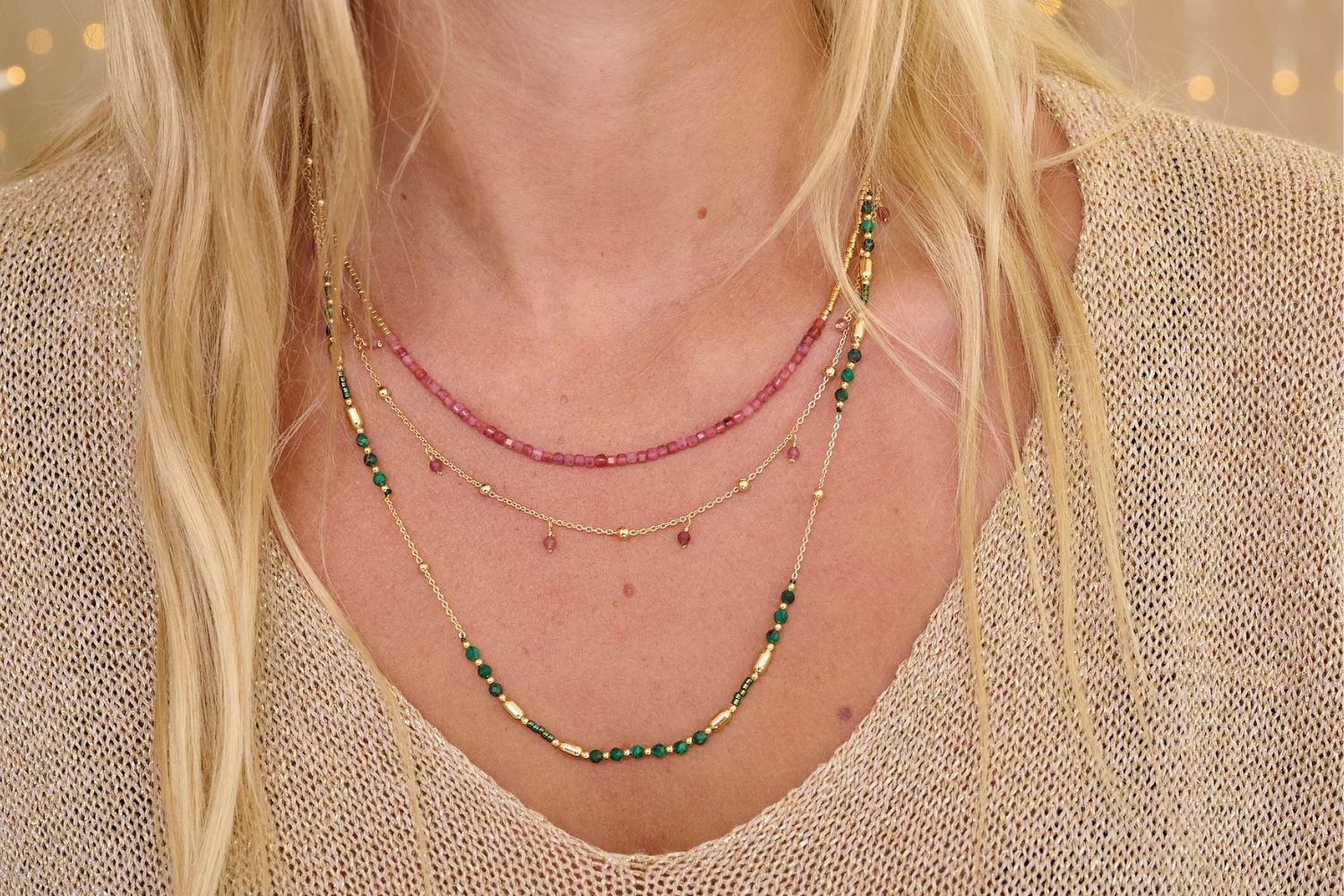 Lily Gold & Pink Tourmaline Beaded Layer Necklace styled on the neck, showcasing its delicate two-tier design with soft pink tourmaline beads and gleaming gold accents, perfect for layering.