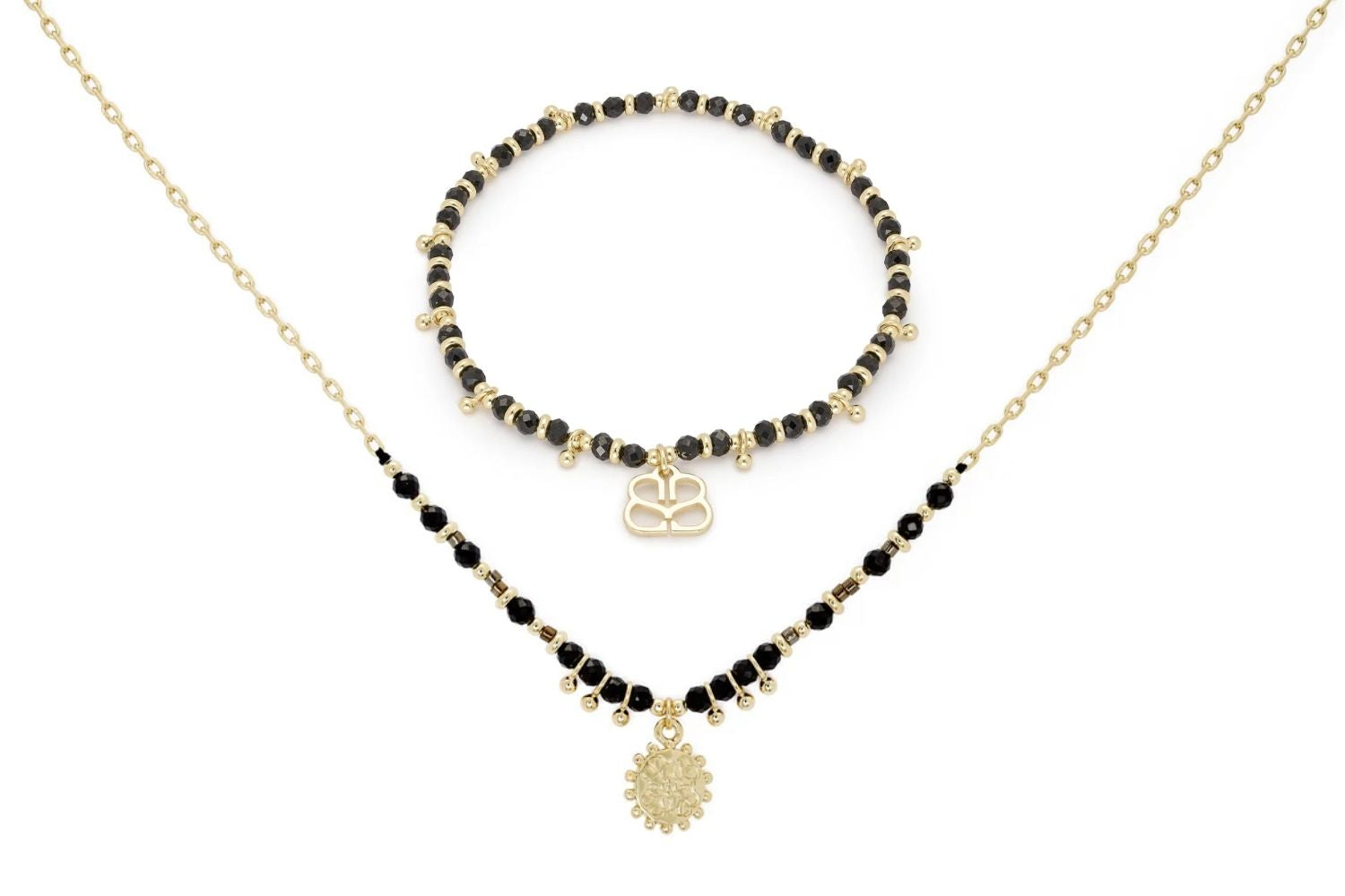 Raven Black Spinel Necklace and Bracelet Set featuring sleek black spinel beads and 12k gold-plated accents, designed for versatile and elegant styling.