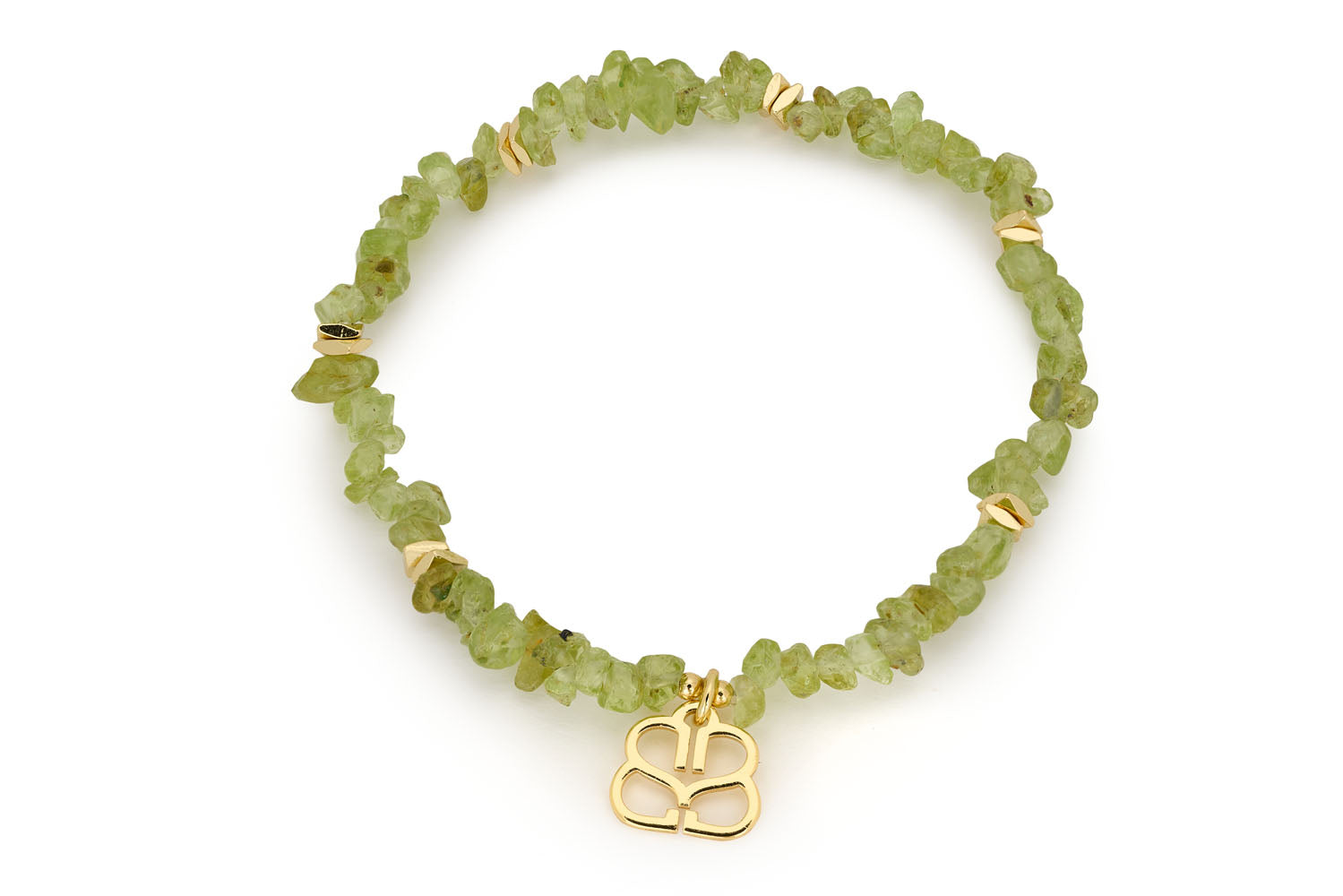 Gold peridot crystal bracelet with rough-cut lime green gemstones and filigree Boho Betty gold charm. A thoughtful August birthstone jewellery piece.