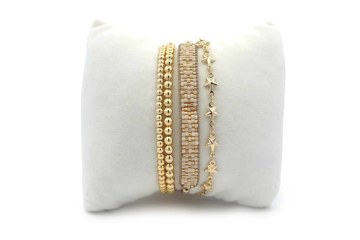 Sumatra Gold Stacking Bracelets featuring creamy Miyuki beads, gleaming gold accents, and celestial star details, perfect for layering or wearing solo.